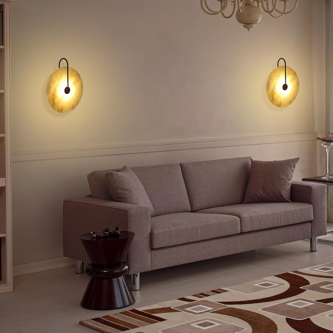 two marble wall lights above a sofa