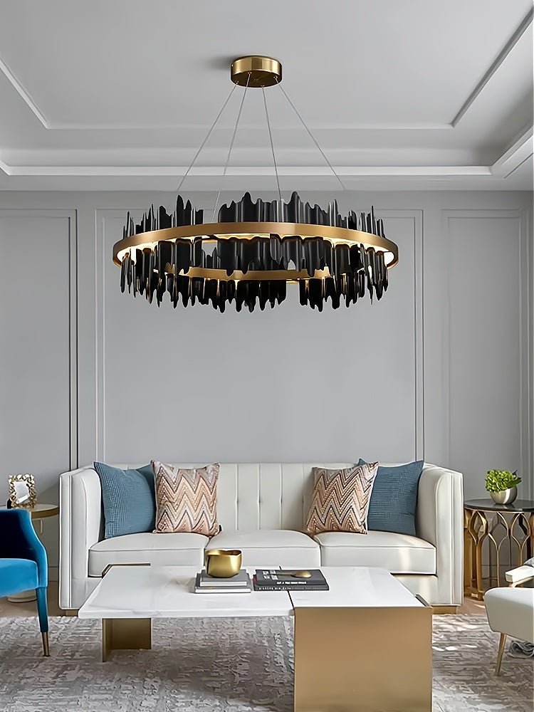 Modern living room with a stylish chandelier, sofa, and coffee table.