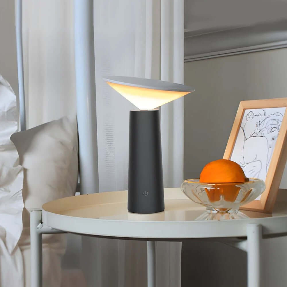 Rivo Cordless Table Lamp illuminating a bedside table with a modern design and a calming ambience.