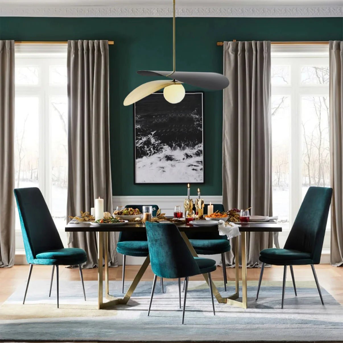 Olivia Pendant Light with frosted glass globe and modern brass finish over dining table