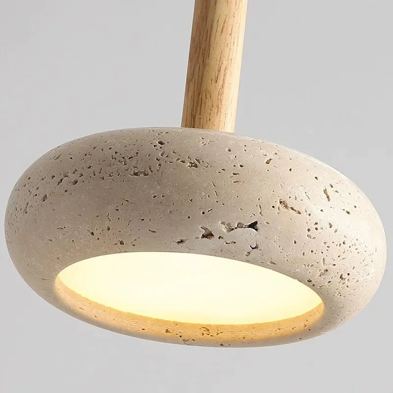 Pendant light with concrete base and wooden fixture on a gray background