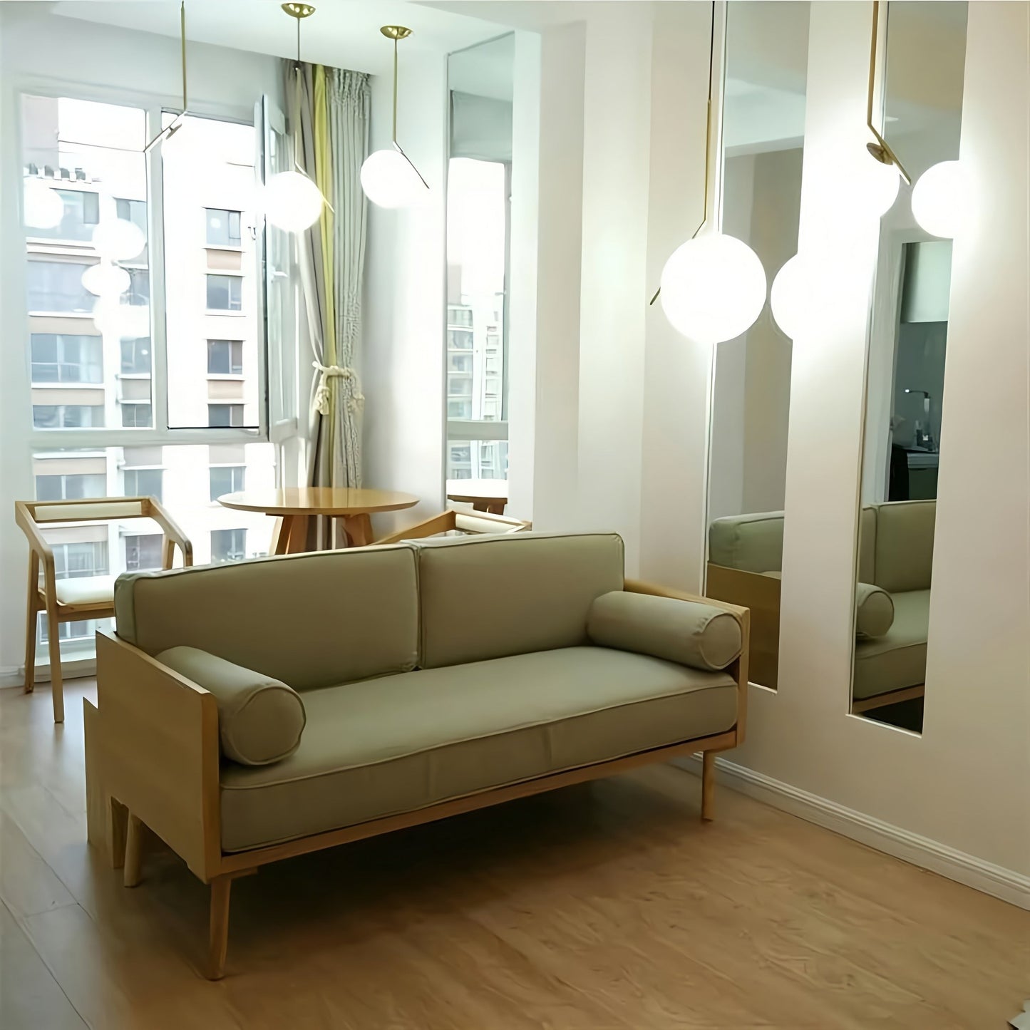 Beige sofa in a room with large windows and modern decor
