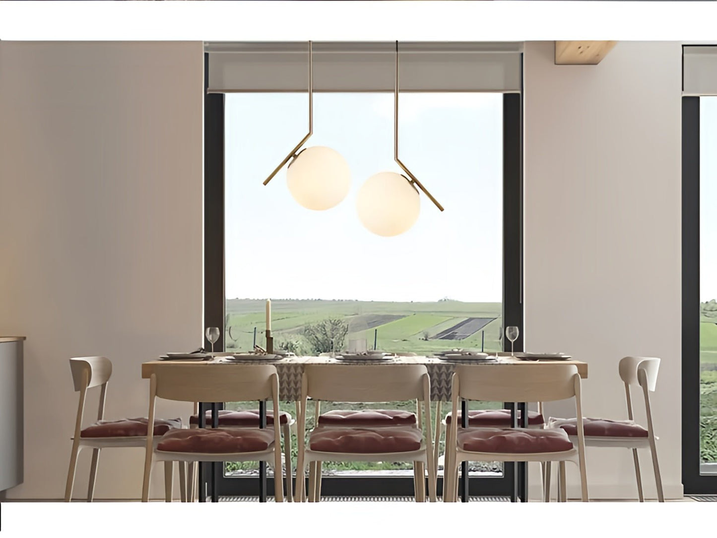 Modern dining room with a large window view of greenery