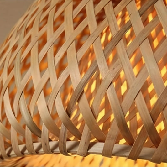 Close-up of a woven wooden lampshade with warm lighting.