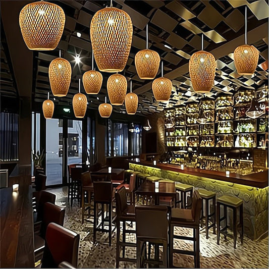 Interior of a restaurant with wooden pendant lights, tables, and chairs.