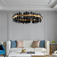 Modern living room with a stylish chandelier, sofa, and coffee table.