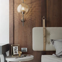 Modern bedroom with wooden wall, bed, and side table.