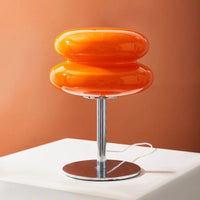 Orange TABLE LAMP on a white platform with an orange background