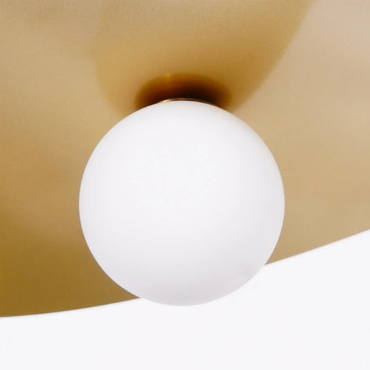 Olivia Pendant Light with frosted glass globe and modern brass finish 
