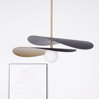 Olivia Pendant Light with frosted glass globe and modern brass finish 