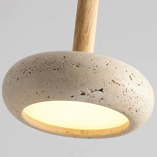 Pendant light with concrete base and wooden fixture on a gray background