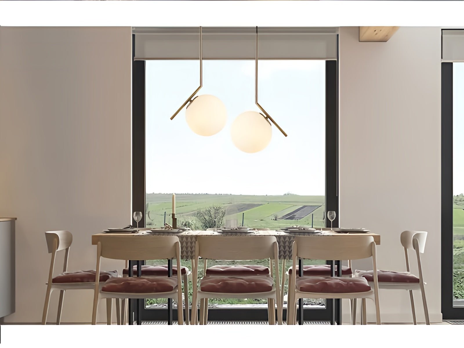 Modern dining room with a large window view of greenery