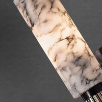 Marble-patterned object on a dark background