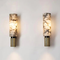 Two wall sconces with marble-patterned shades and gold bases on a light gray background.