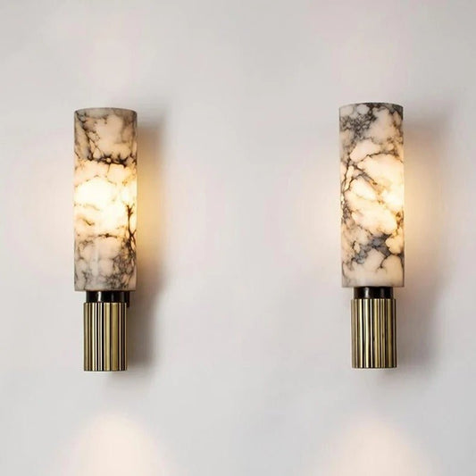 Two wall sconces with marble-patterned shades and gold bases on a light gray background.